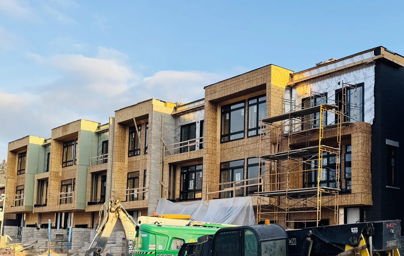Townhome row mid-construction, before cladding installation
